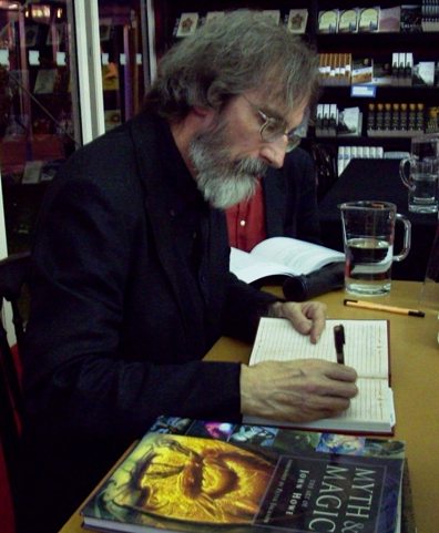 John signs the Red Book